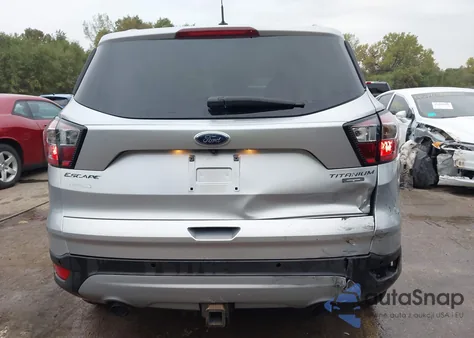 2017 Ford Escape Titanium z USA, uszkodzony, nr VIN 1FMCU0J90HUB80160